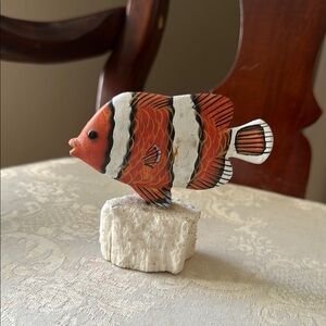 Hand carved, painted wood clown fish sculpture on coral base